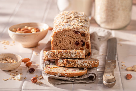 Fit delicacies bread with nuts, raisins and dried fruits. Bread with nuts, raisins and bran.の写真素材