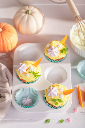 Traditionally pumpkin muffins baked and decorated for Halloween. Dessert for the Halloween.の写真素材