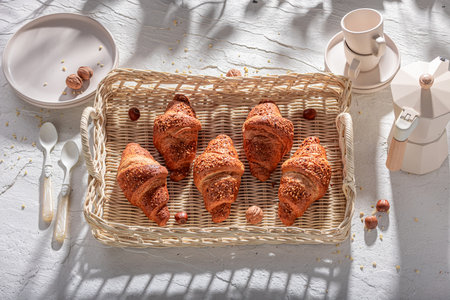 Crunchy and tasty french nut croissants made of puff pastry. Breakfast with coffee and croissants.の写真素材