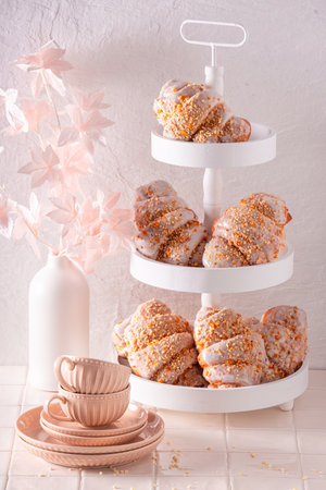 Golden saint martin's croissant served with coffee. Croissants baked for St. Martin's Day.の写真素材