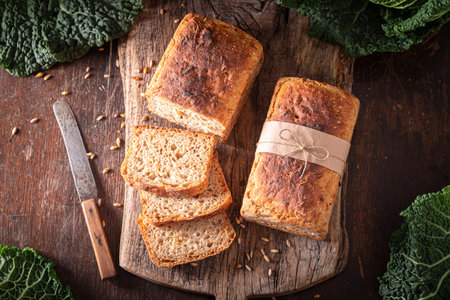 Homemade sauerkraut bread freshly baked and sliced. Bread made from grains and sauerkraut.