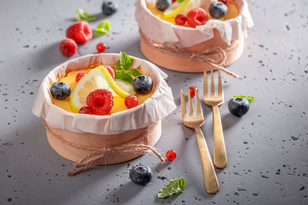 Sweet New York cheesecake flavored with vanilla and lemon. Lemon cheesecake with berry fruits.の写真素材