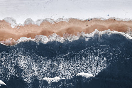 Winter swim in cold Baltic sea for improve health, aerial view of Poland