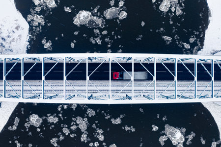 Top down view of bridge over river with floe, aerial view of Poland