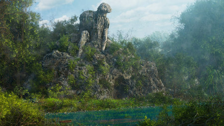 Huge stone statue in the middle of the forest with green trees.の素材