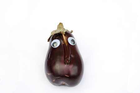 Eggplant with eyes and noseの写真素材