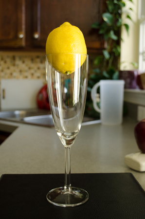 Glass and lemon on the topの写真素材