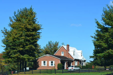 beautiful house with trees and blue sky background