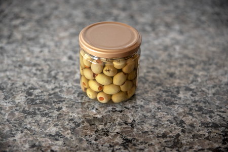 Olives in a glass jarの写真素材