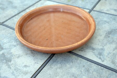 Earthen pot filled with waterの写真素材