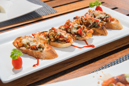 Bruscetta with vegetables and cheeseの写真素材