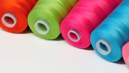 Group of colorful spool of sewing threadsの写真素材