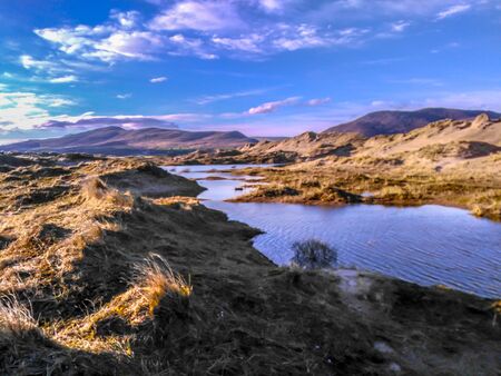 Shallow Pond inbetween Dunes and Oceanの写真素材