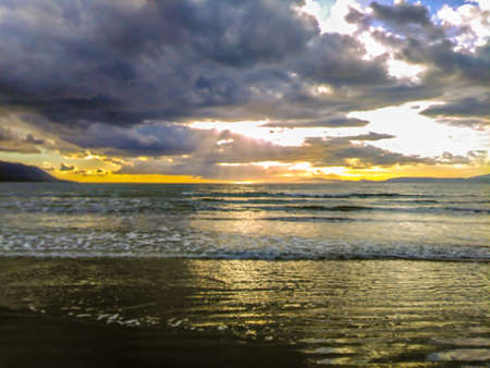 Coastal Sunset with Tidal Waves at Inch Beachの写真素材