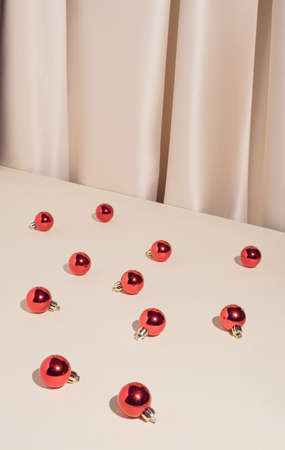 Minimal stylish holiday decoration composition with red Christmas bauble ornaments. Trendy and elegant vintage concept.の写真素材