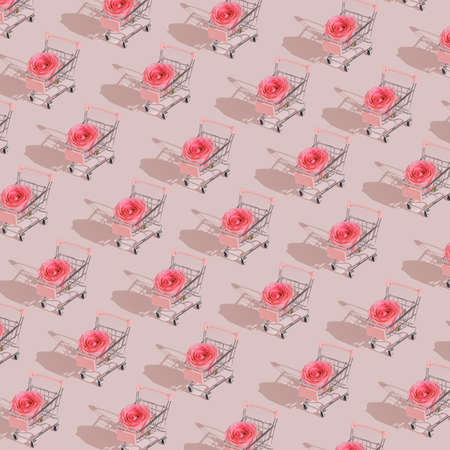 Pastel pink Valentine shopping pattern made with cart and rose. Minimal modern concept.の写真素材