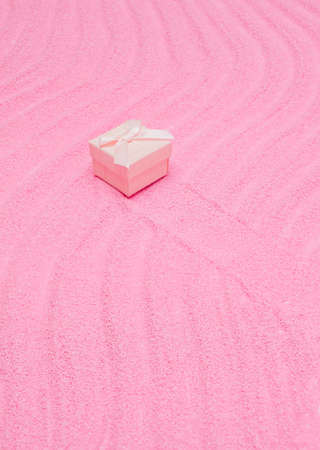 Pink Valentine's Day or birthday box in pastel sand. Minimal, trendy aesthetic.の写真素材