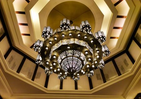 Morocco Ornate brass chandelier in the courtyard of a mosque in Qatar. Morocco style brass chandelier. Morocco Tourism, Morocco culture, Morocco Travel.の写真素材