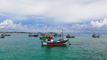 Sri Lankan traditional fishing catamarans, Colorful fishing boats docked docked in the port of Beruwala, Sri Lanka.Srilankan traditional fishing industry. similar to india and asia.の写真素材