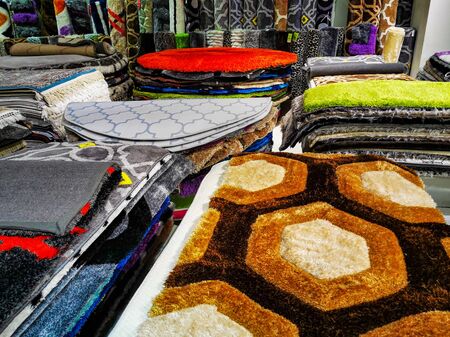 Multicolored carpets or rugs or floor mats available for sale at a retail store in Dubai, UAEの写真素材