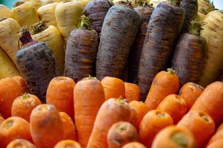 Background:mix of orange ,purple and white carrots