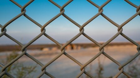 Background image of a garden chain link fence fenceの写真素材