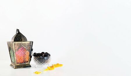 Background image with white background with arabic lantern, dates and beads. Ramadhan and Eid conceptの写真素材
