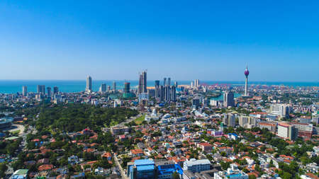 View of the Colombo city skyline with modern architecture buildings including the lotus towers. during sunsetの写真素材