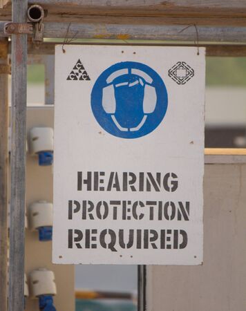 12 October 2019- Doha,Qatar- Hearing Protection Required Sign Board in Constructionの写真素材
