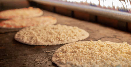 Background image of pizza production in a hot oven.Pizza production