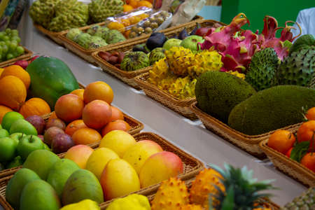 background: Mix of Assorted Fresh fruits at a shop for saleの写真素材