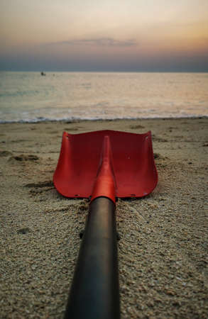 Background image of shovel on the sea.shovels are used to build sand castles on the sea.