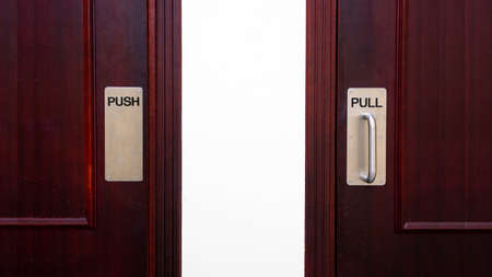 Push and pull sign on a door at a apartment.の写真素材