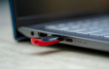 USB flash drive plugged in laptop. pen drive