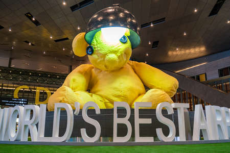 DOHA, QATAR - November 16, 2021 : Lamp Bear by Swiss artist Urs Fischer at the centre of the retail area of Hamad International Airport Terminal.のeditorial素材