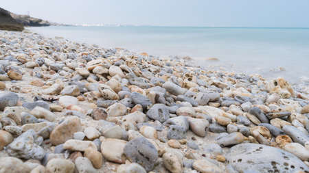Beautiful Jebel Fuwairit Beach landscape with pebbles in Qatar.