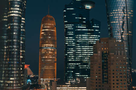 Doha, Qatar- March 03,2022 : Qatar skyline during sunset with colorful sky.のeditorial素材