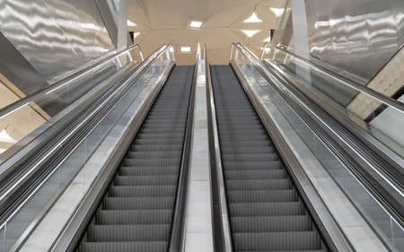 Doha, Qatar- March 03,2022: The interior of one of the metro station in doha city, long staircases