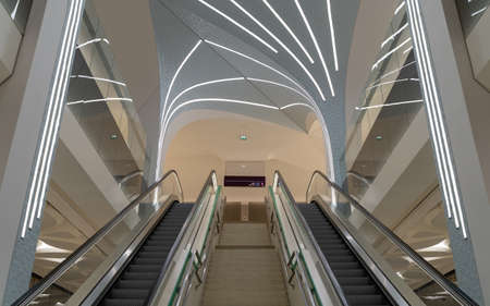Doha, Qatar- March 03,2022: The interior of one of the metro station in doha city, long staircases
