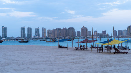 dhows in the shore parked at katara beach in qartar during dhow festival int he background with the...