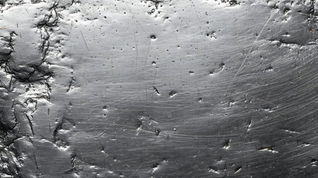 Metal texture with scratches and cracks. Can be used as a backgroundの素材