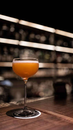 Enjoy a Side Car cocktail at the bar aloneの写真素材