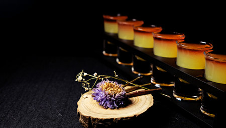 A purple flower in a colorful drink