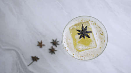 Anise spice and drink on marble tableの写真素材