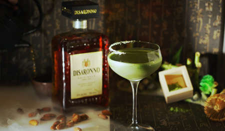 A green cocktail made with AMARETTO DISARONNOの写真素材