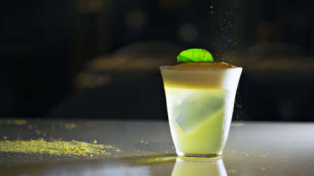 Sprinkle gold dust into a frothy drinkの写真素材