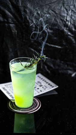 Green drink with rosemary smokeの写真素材