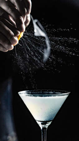 Spray citrus peel oil on cocktailの写真素材