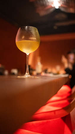 A cocktail on the bar with red lightの写真素材