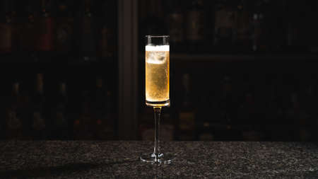 A glass of champagne cocktail on the marble barの写真素材